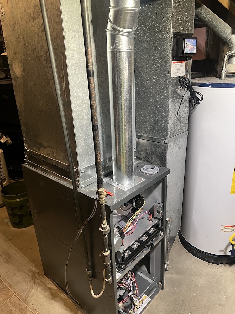 Furnace access panel opened for repair by L.A. Heating & Cooling, Columbus OH